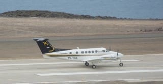 Crowd control on St. Helena as 1st fixed wing lands