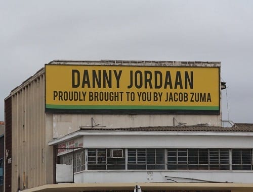 Broken Danny Jordaan protecting a broken president