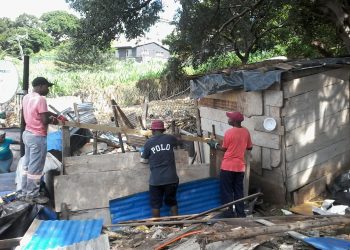 Woman allegedly shot during shack demolition