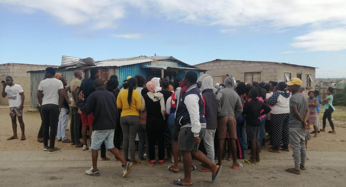 Township residents protect spaza shops from looters