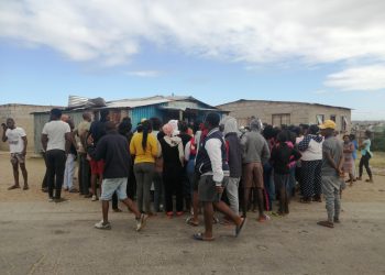 Township residents protect spaza shops from looters