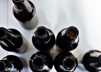 Police probe picture of officers posing with alcohol