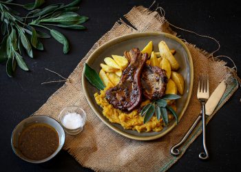 Pork chops with mashed butternut and wedges