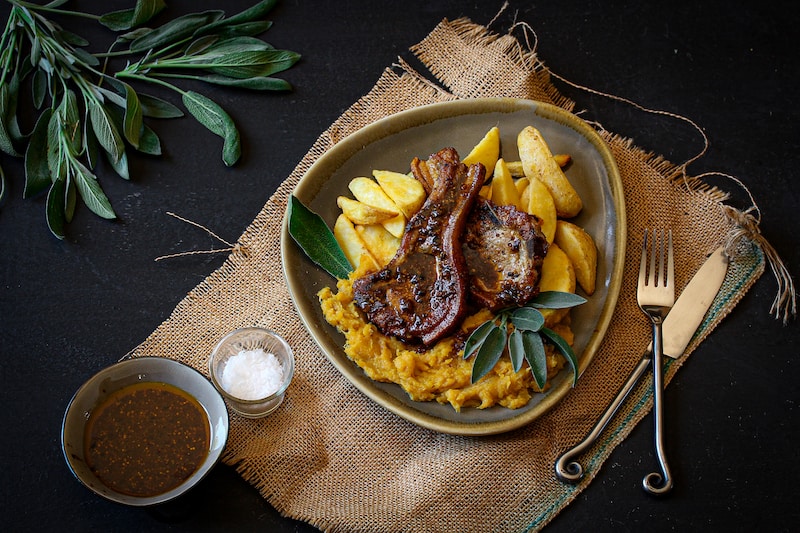 Pork chops with mashed butternut and wedges
