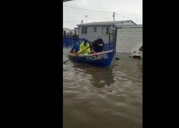Struisbaai in flood, fishermen row boats in the streets