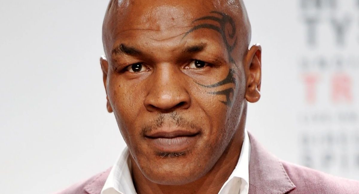 Mike Tyson punches a fan multiple times on a plane