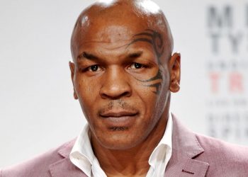 Mike Tyson punches a fan multiple times on a plane